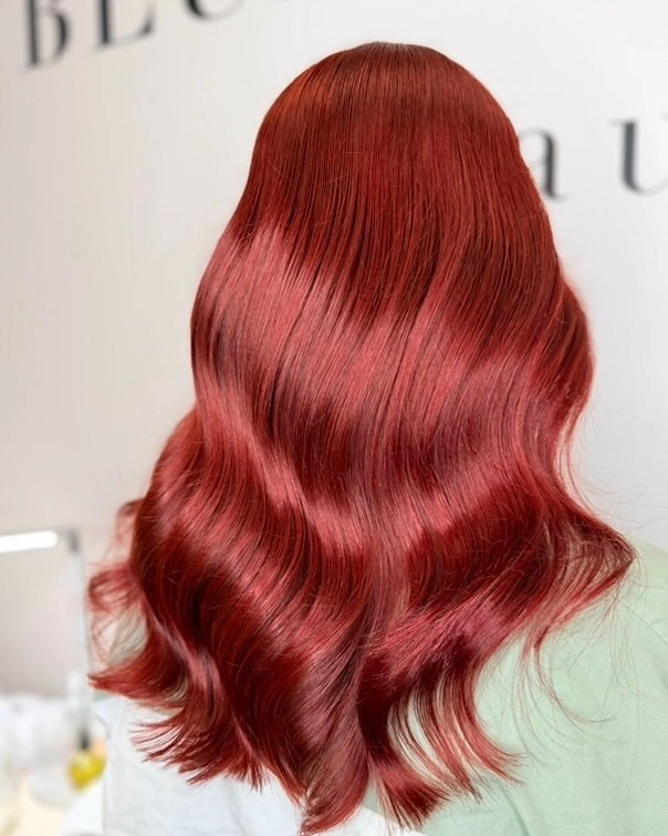Long vivid red hair with defined smooth S waves