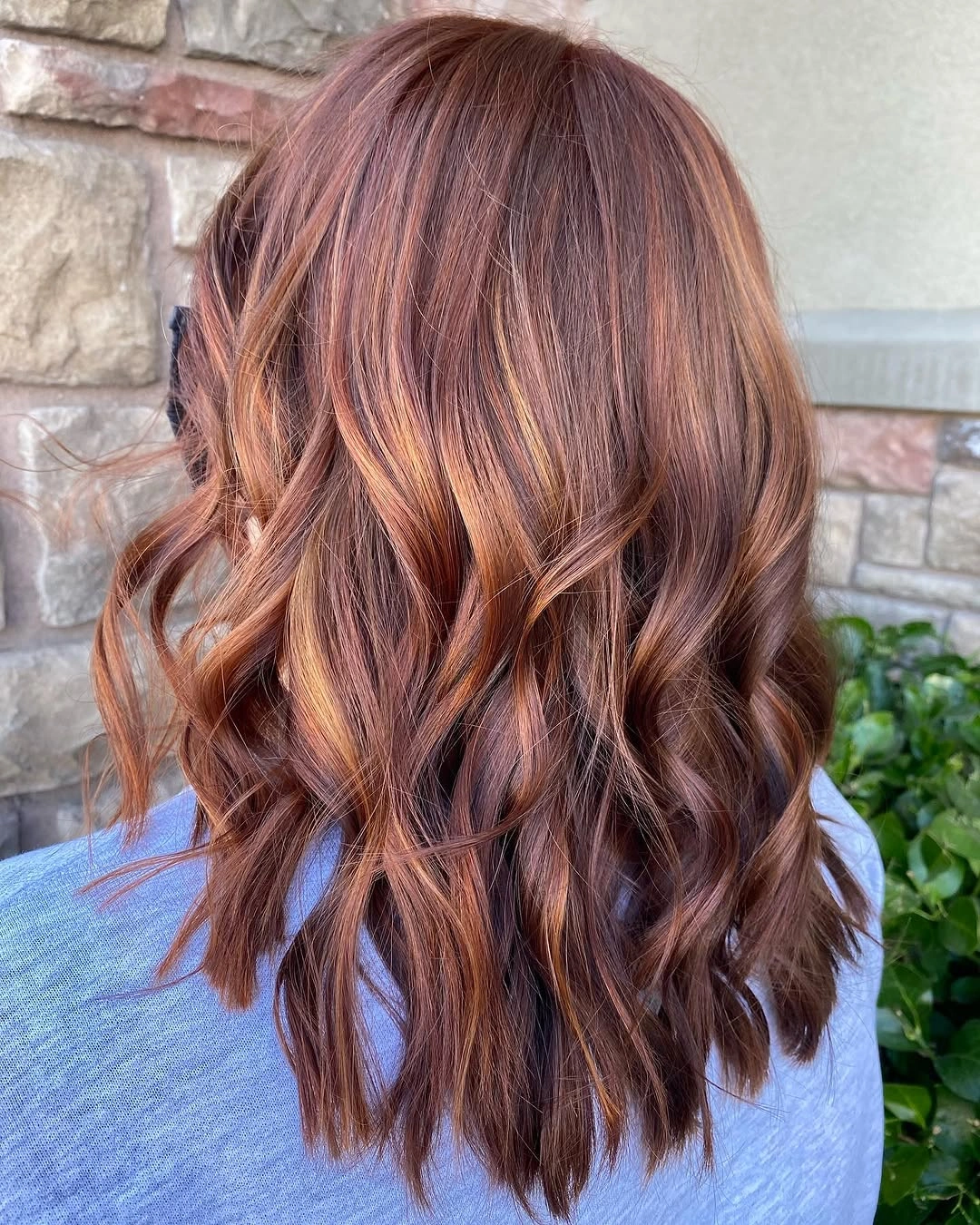 Medium long dusty rose hair with loose waves from the back