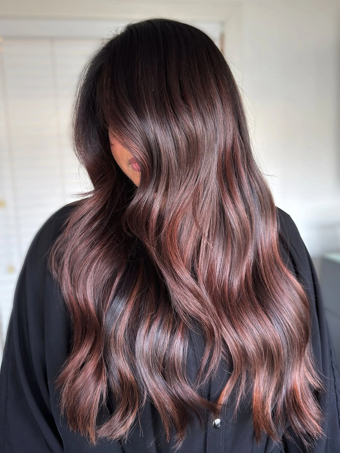 Long dark brunette hair with cool mauve brown waves