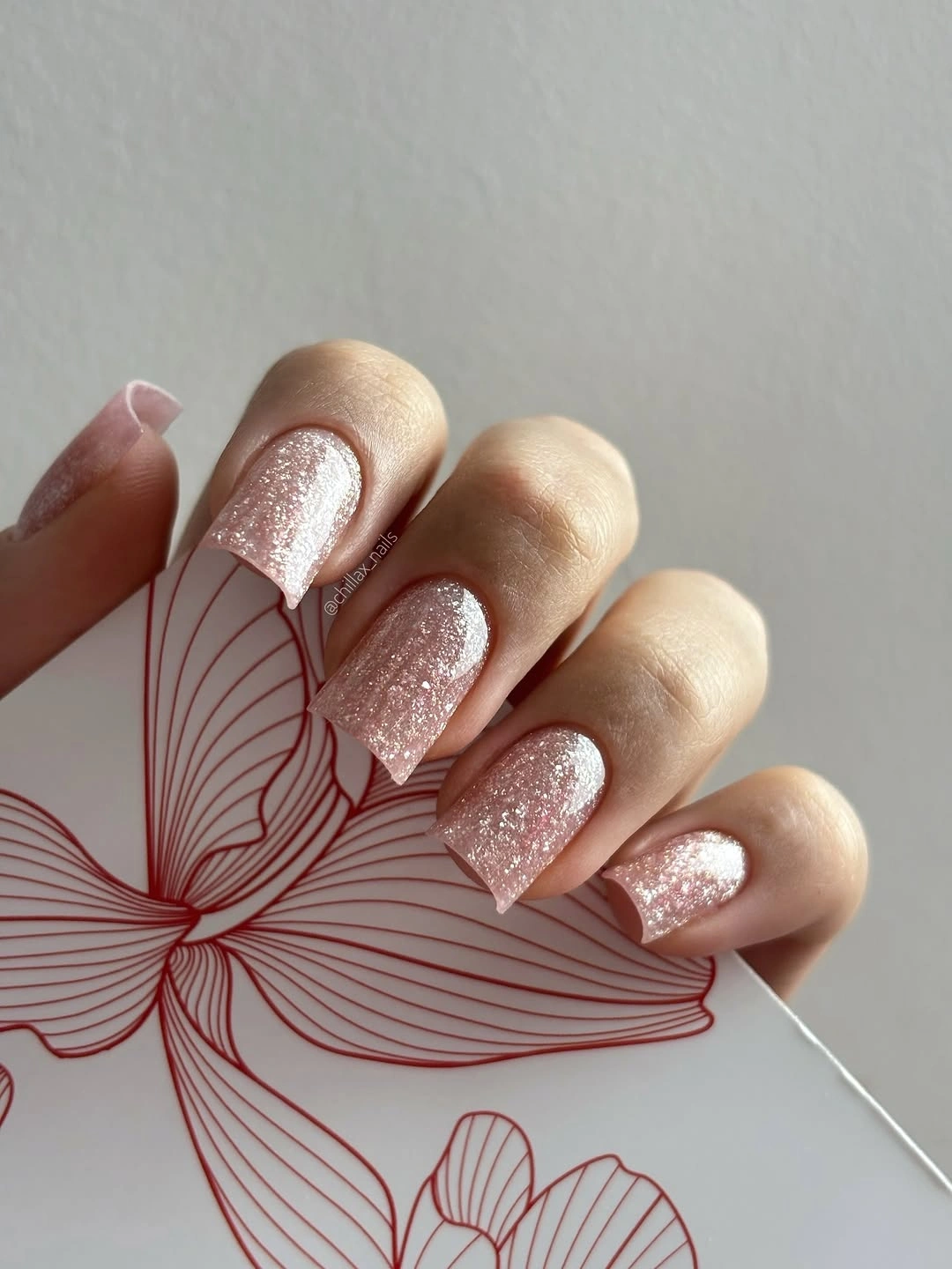 Short square pale pink nails with fine rose gold shimmer