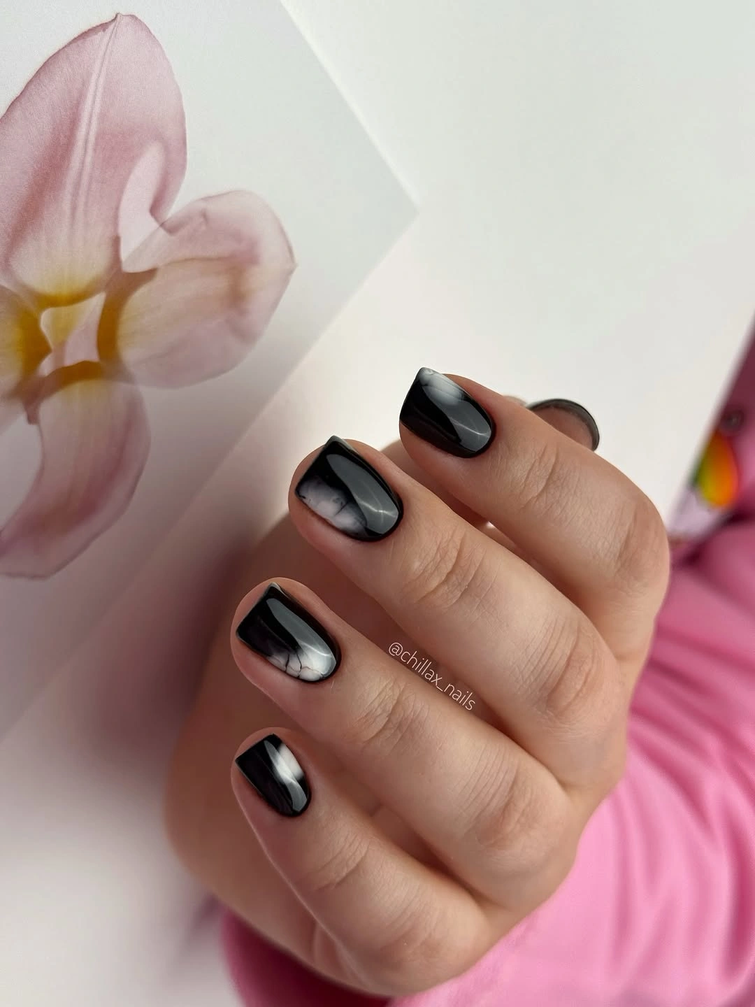 Medium almond nails in smooth high-gloss black polish