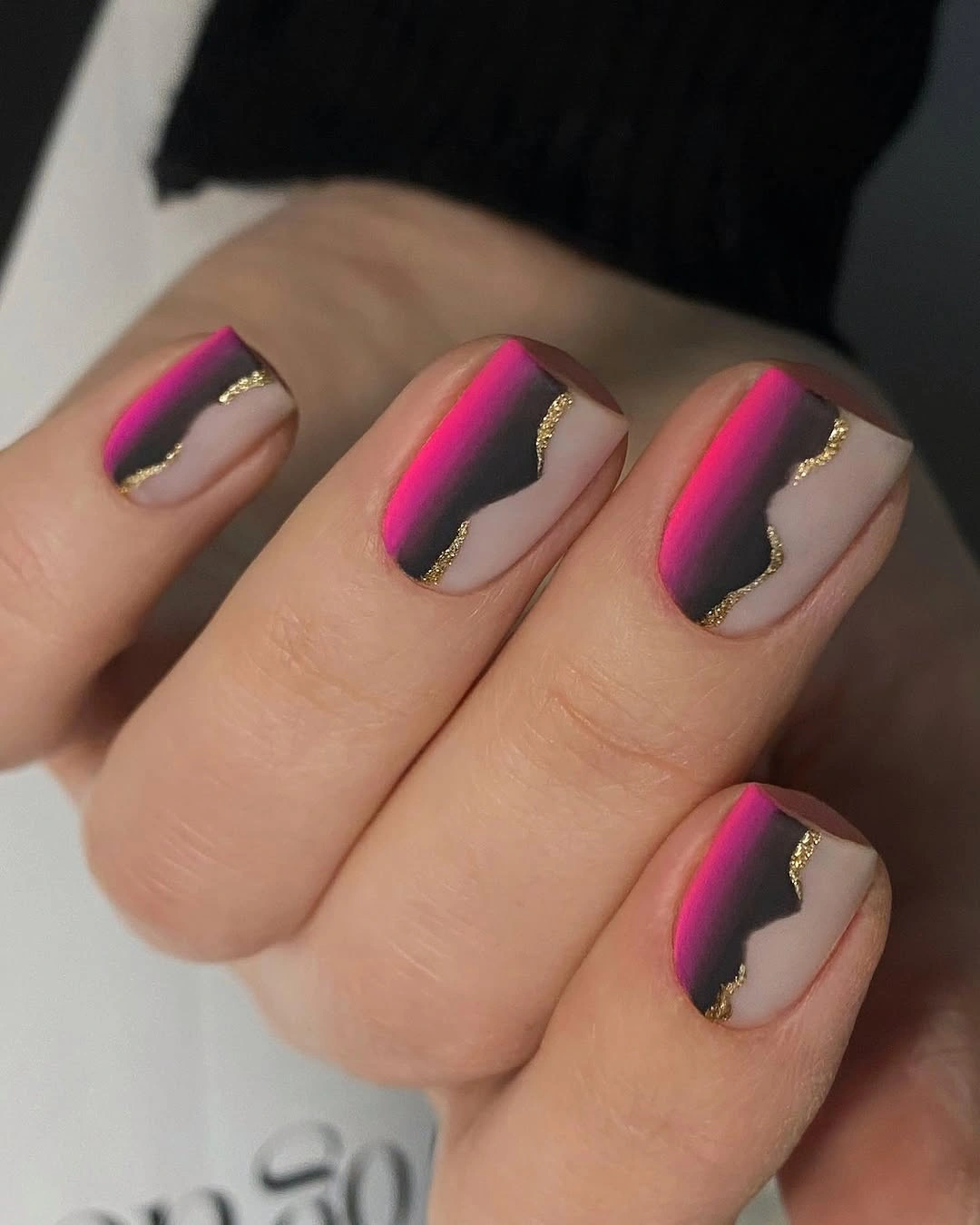 Short square nude nails with hot pink side blocks and fine accents