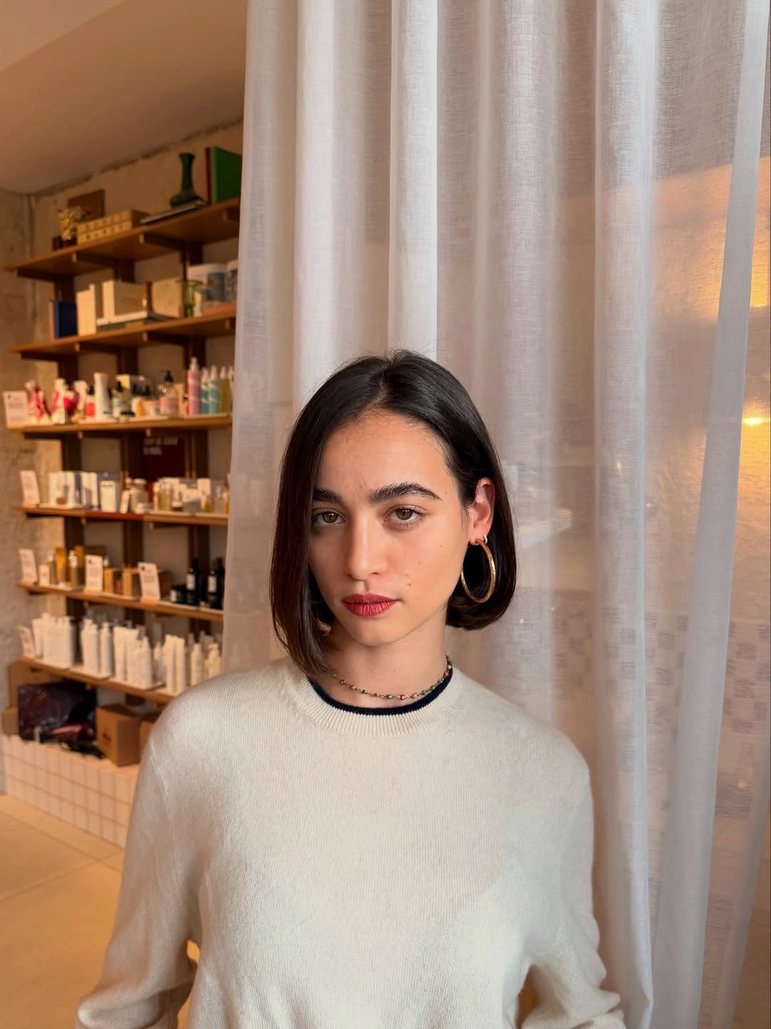 Short dark bob with side part and tucked side