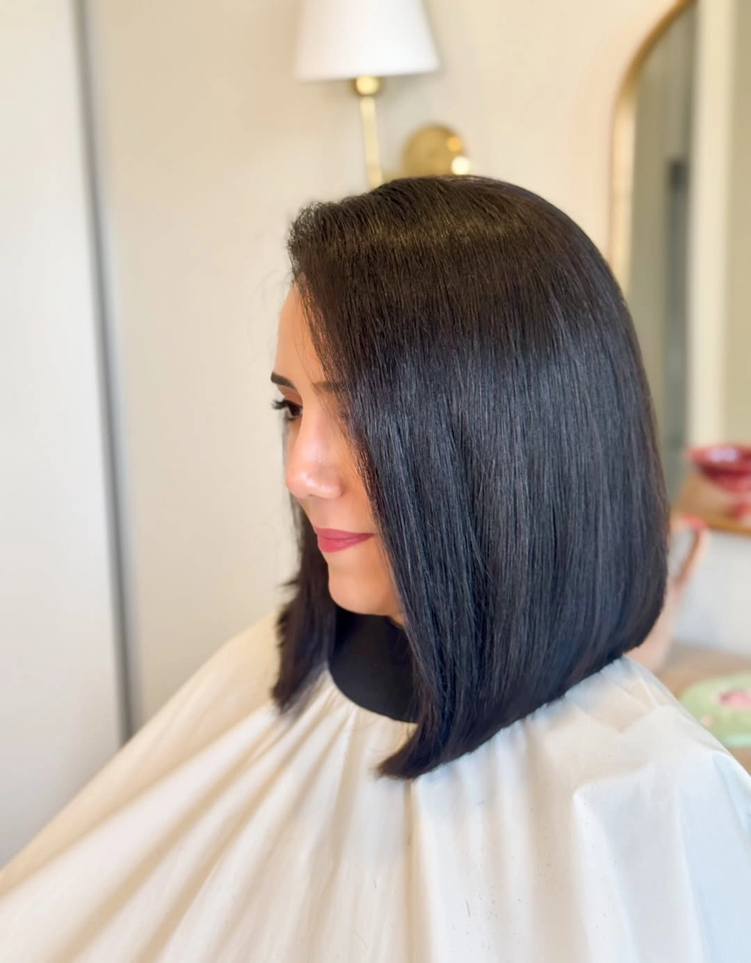Glossy dark side-profile bob with longer front