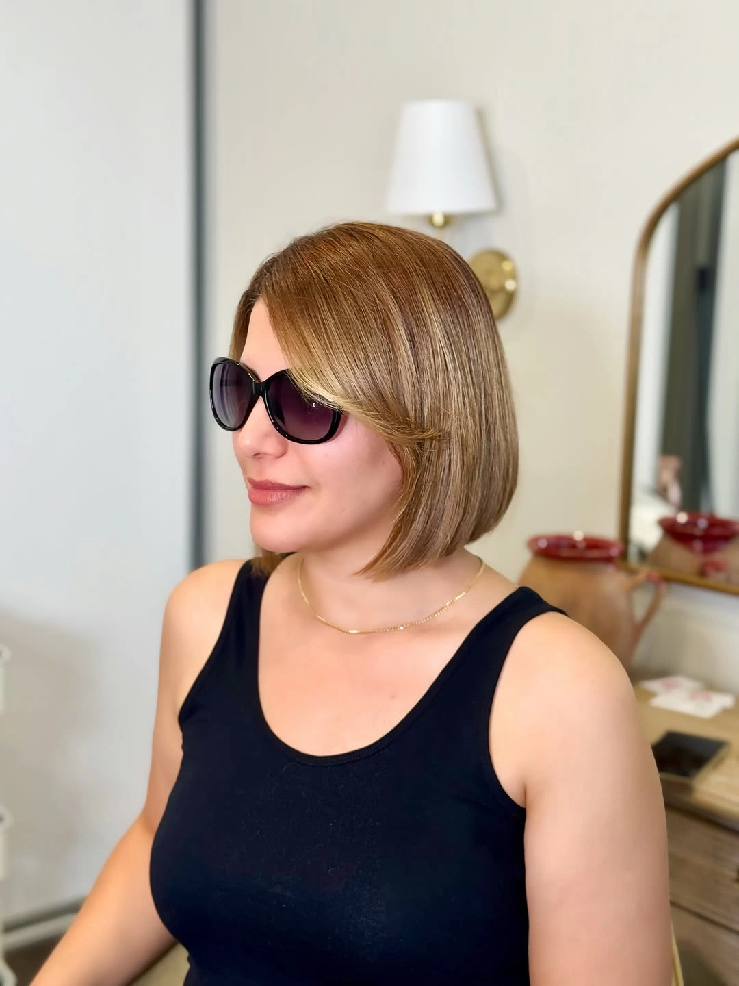 Soft blonde-brown bob with side-swept front