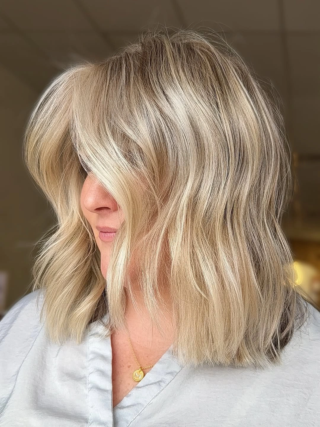Blonde wavy long bob with curtain-like front pieces