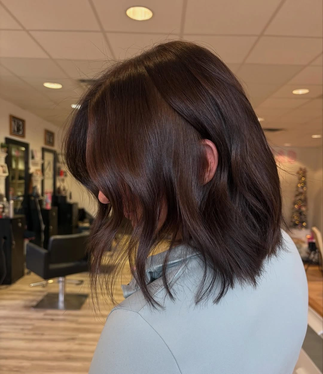 Warm brunette bob with side-swept fringe and soft waves