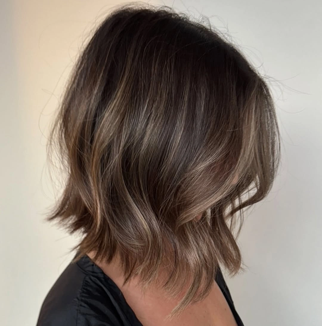 Rear three-quarter layered brunette bob with lighter ribbons