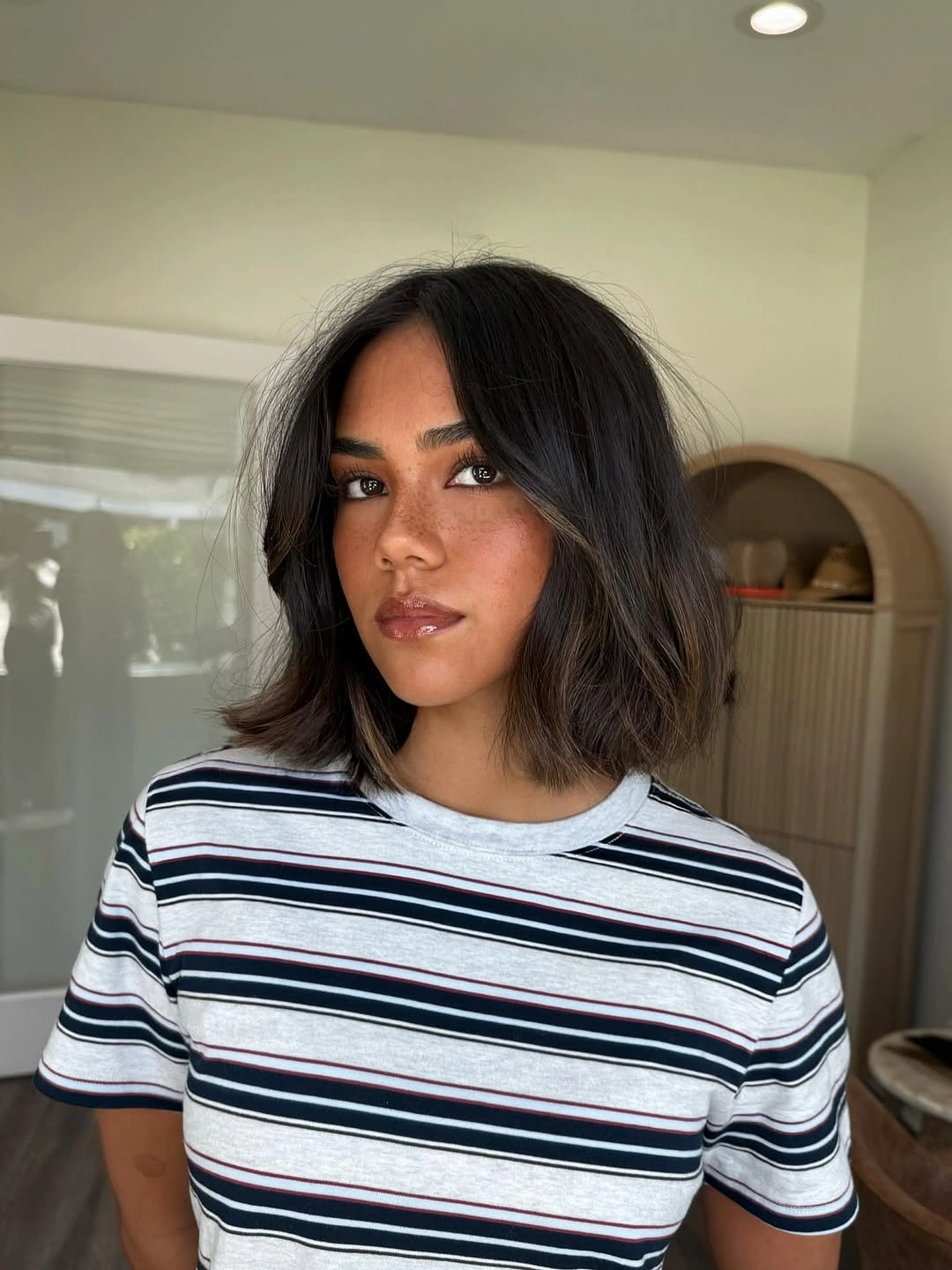 Dark medium bob with center part and outward bends