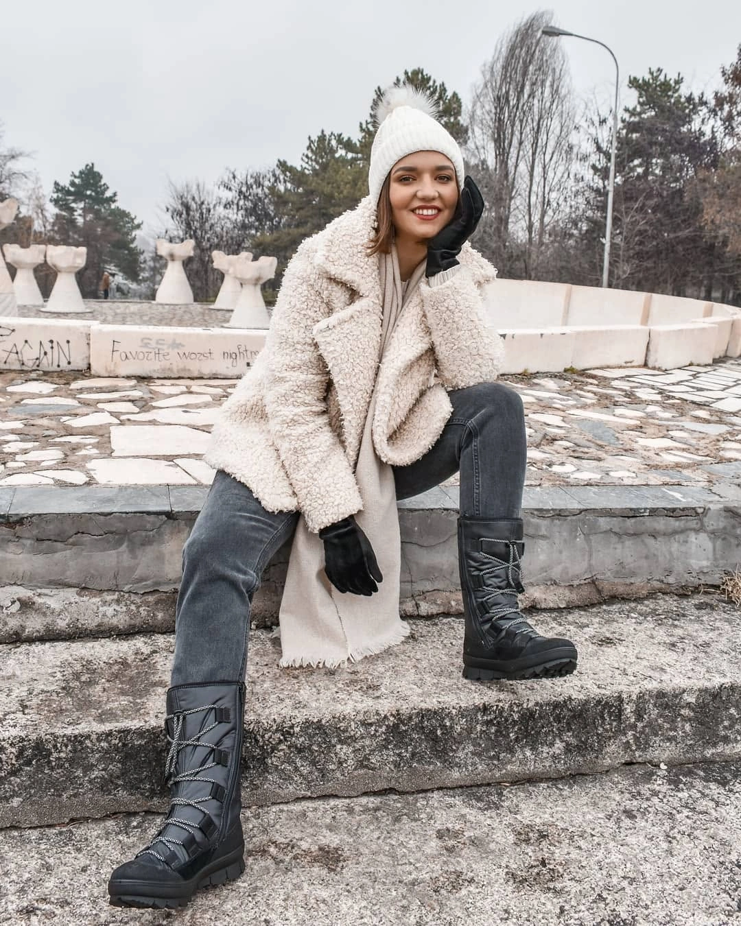 Polished Boots Beneath a Long Coat