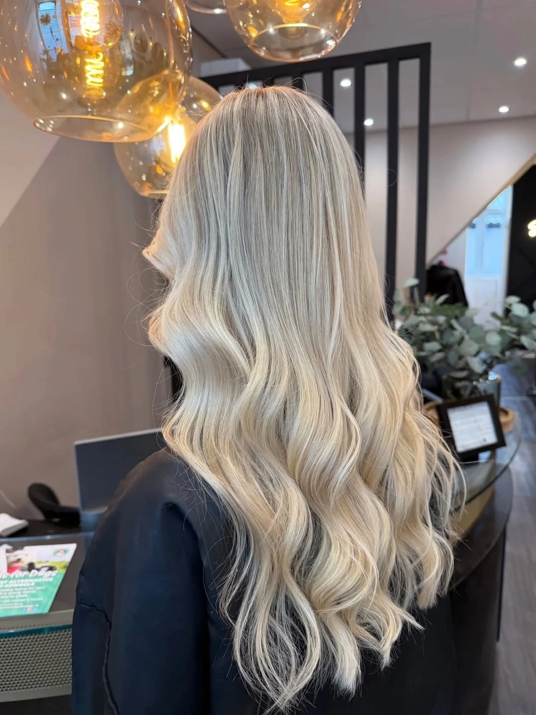 Back view of very long ivory blonde hair with soft waves