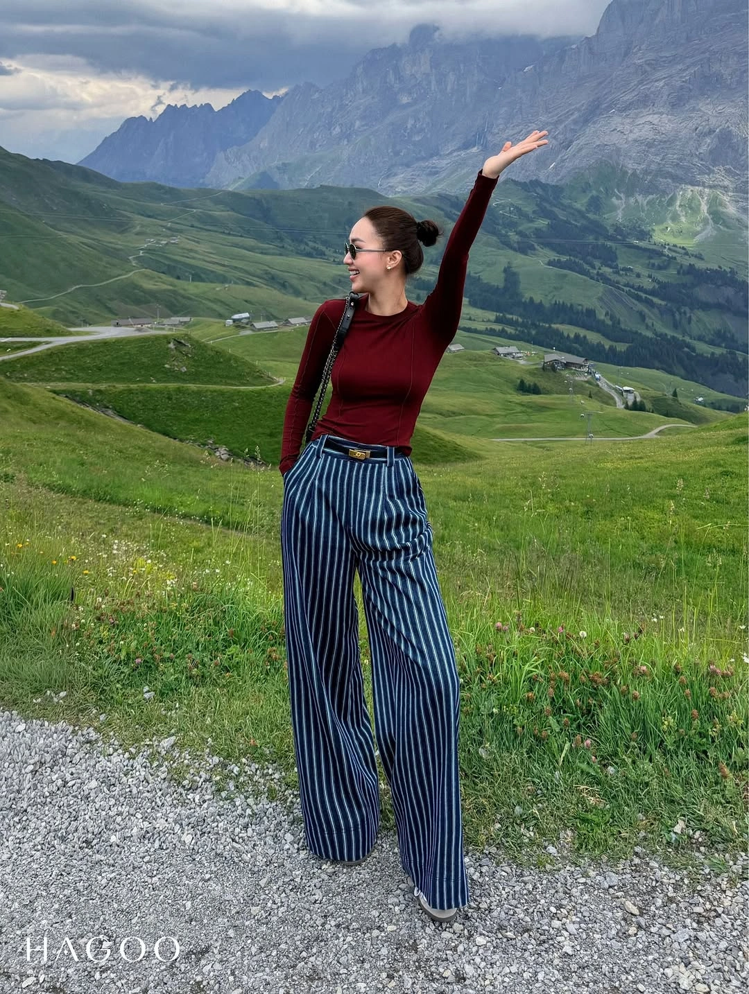 Burgundy fitted top with blue striped wide trousers