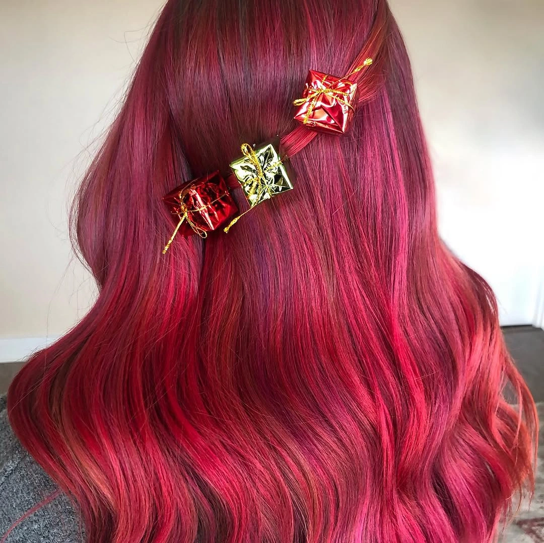 Long red wavy hair with three miniature wrapped-gift ornaments