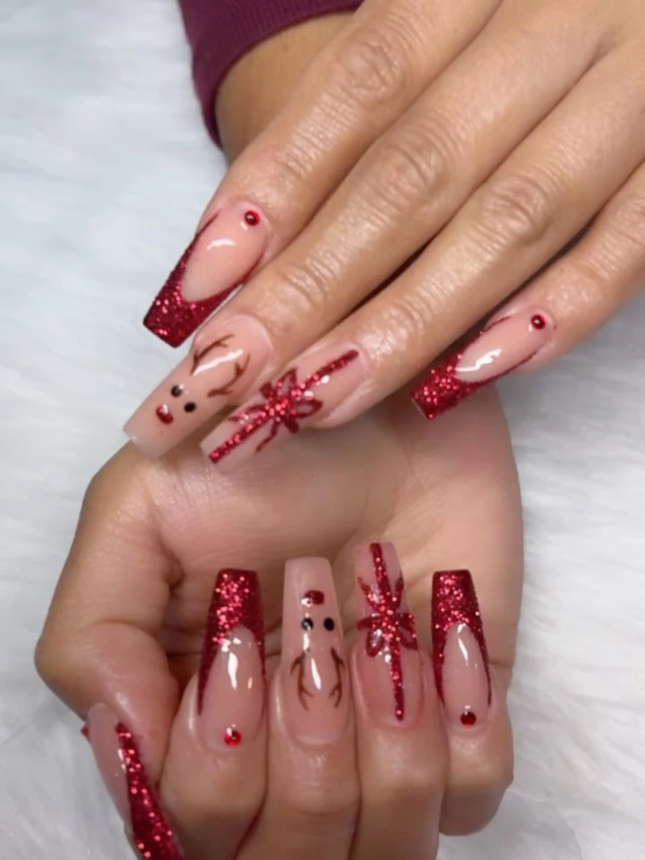 Long coffin nails with red glitter French tips and bow details