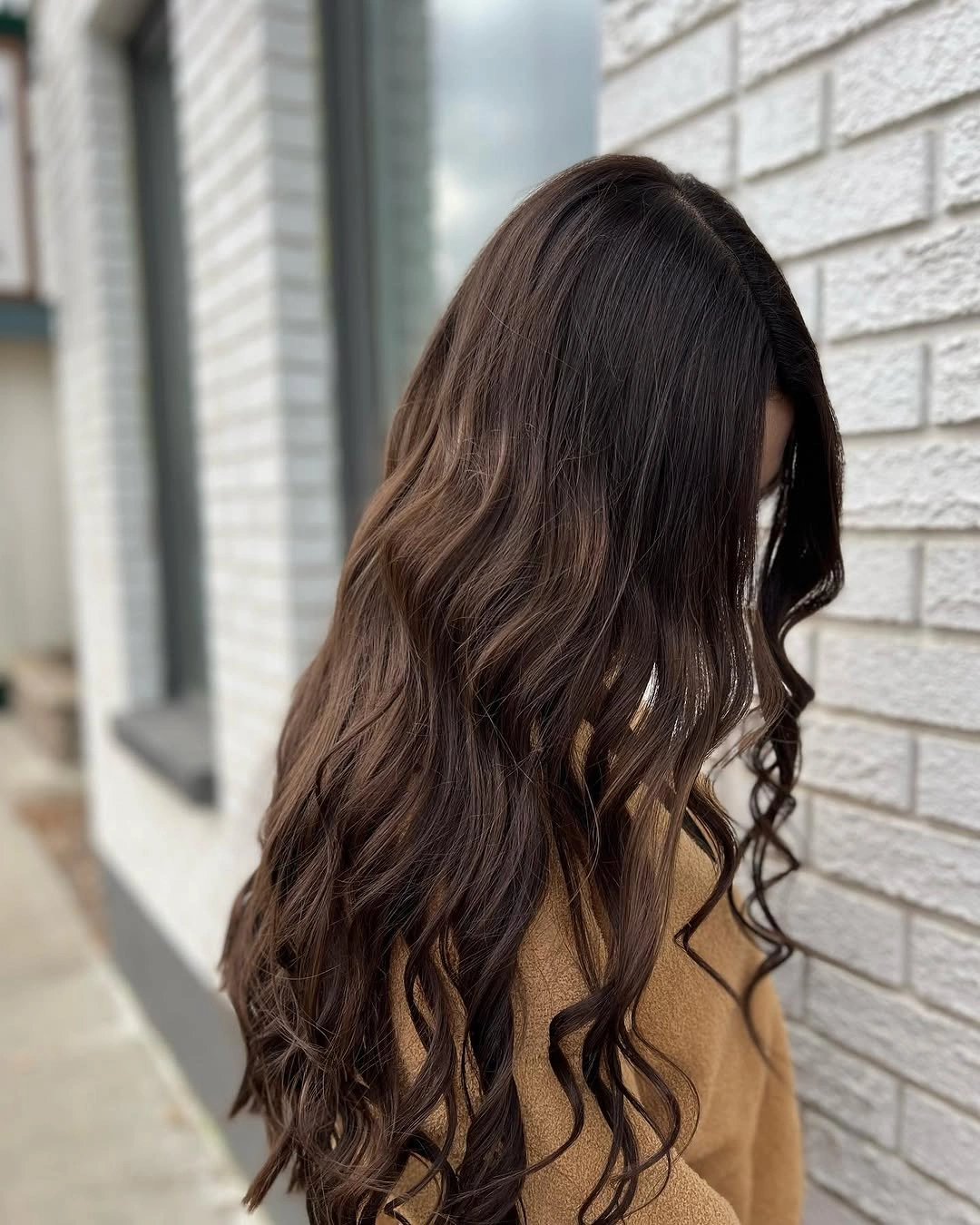 Long dark brunette loose curls with warm brown ends