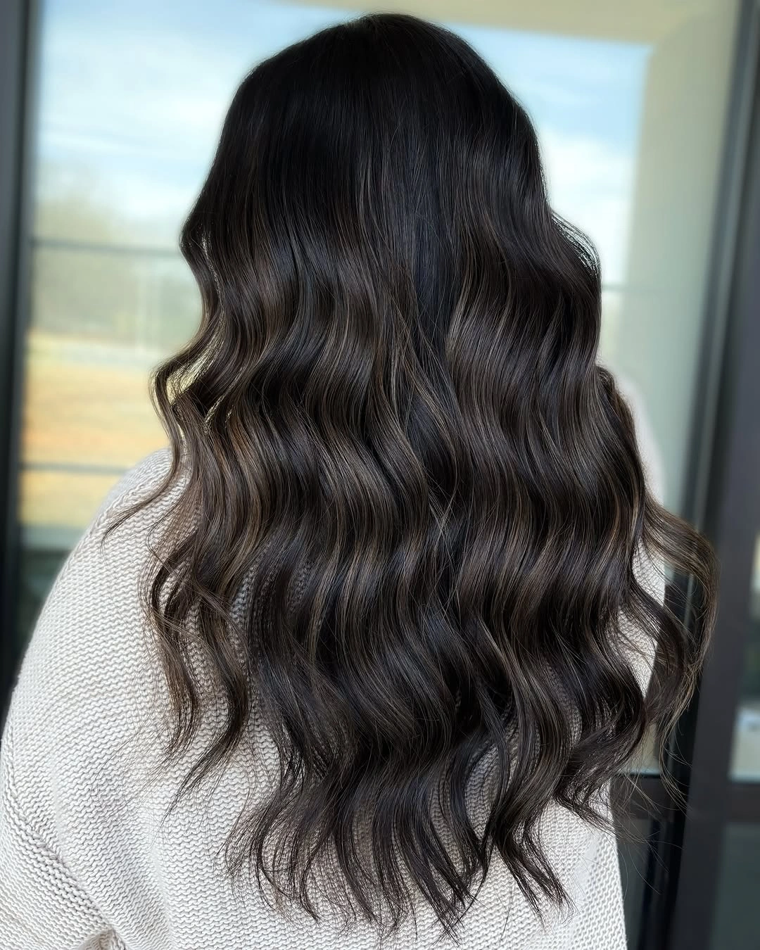 Long near-black brunette waves with smoky brown shine