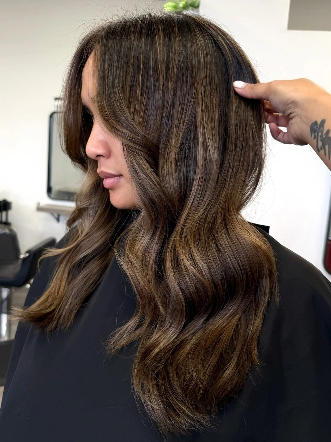 Medium brunette layers with curtain fringe and caramel gold ribbons