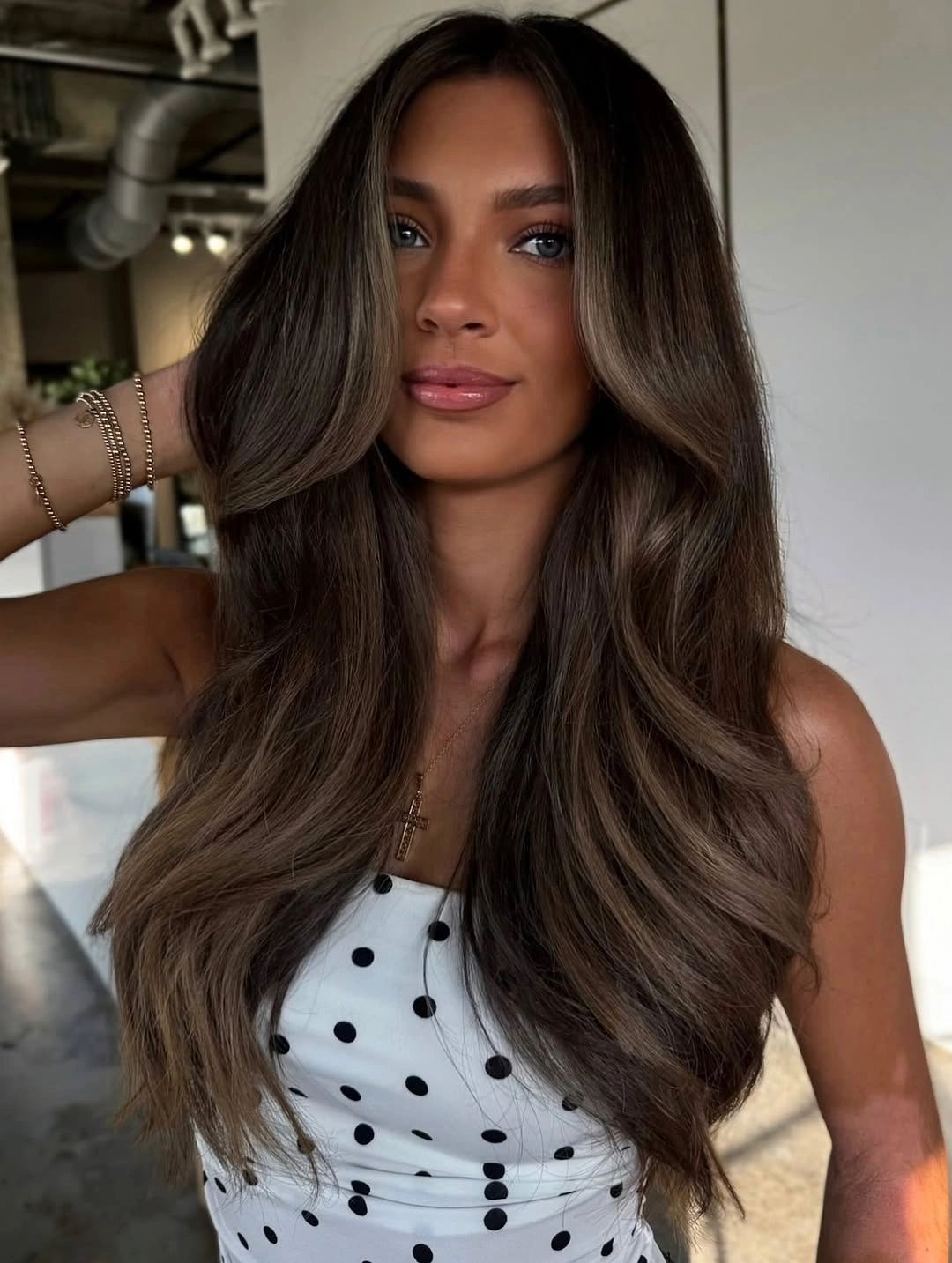 Long layered brunette hair with smoky beige brown ribbons