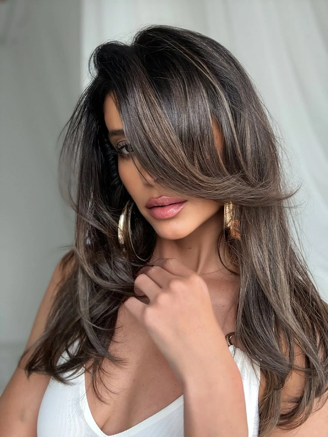 Medium-long layered brunette with ash beige side-swept front