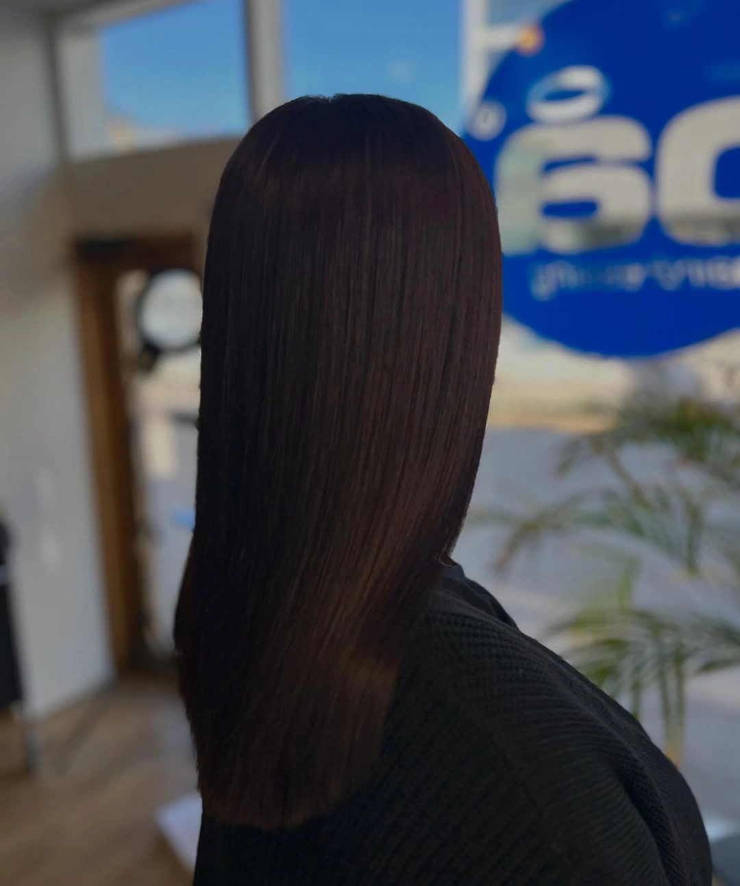 Straight dark brunette hair with smooth finish and blunt ends
