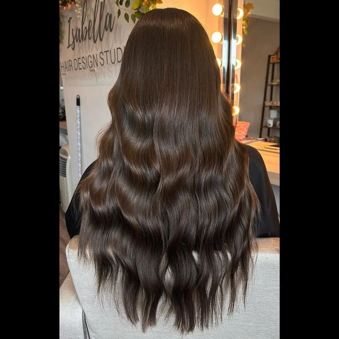 Back view of long dark chocolate brunette waves