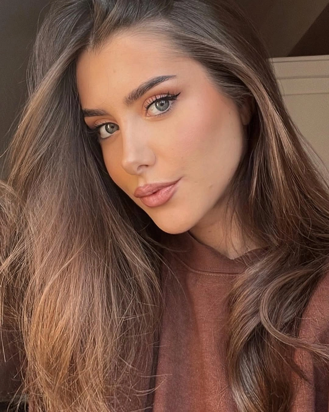 Long brunette hair with warm caramel lower lengths