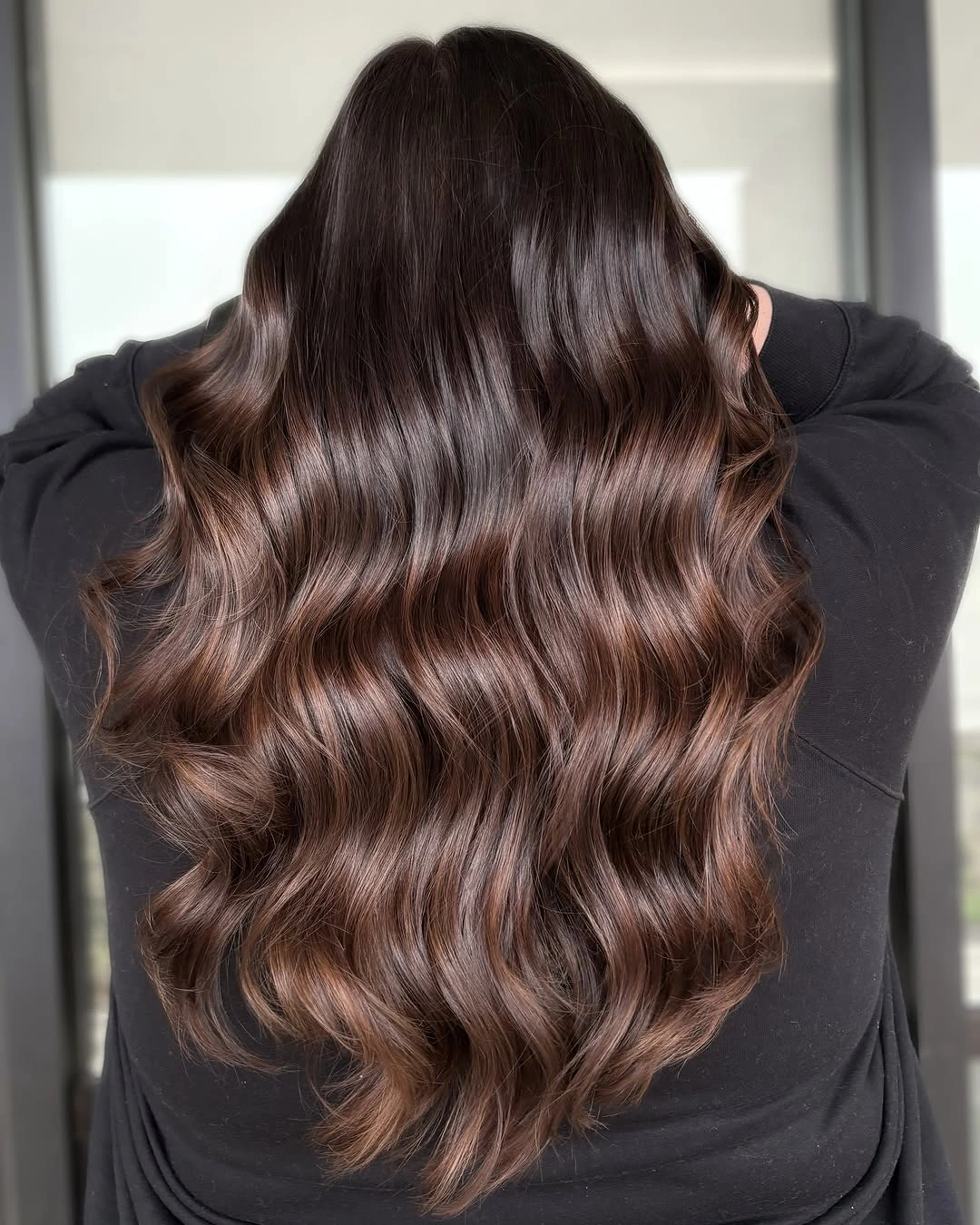 Back view of chocolate brunette waves with cocoa auburn ribbons