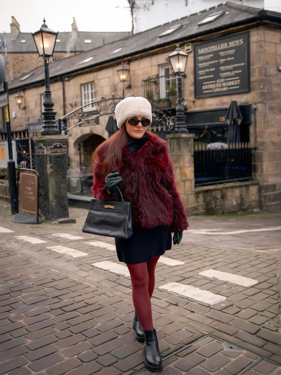Deep burgundy textured jacket with matching tights, pale beret, and black ankle boots