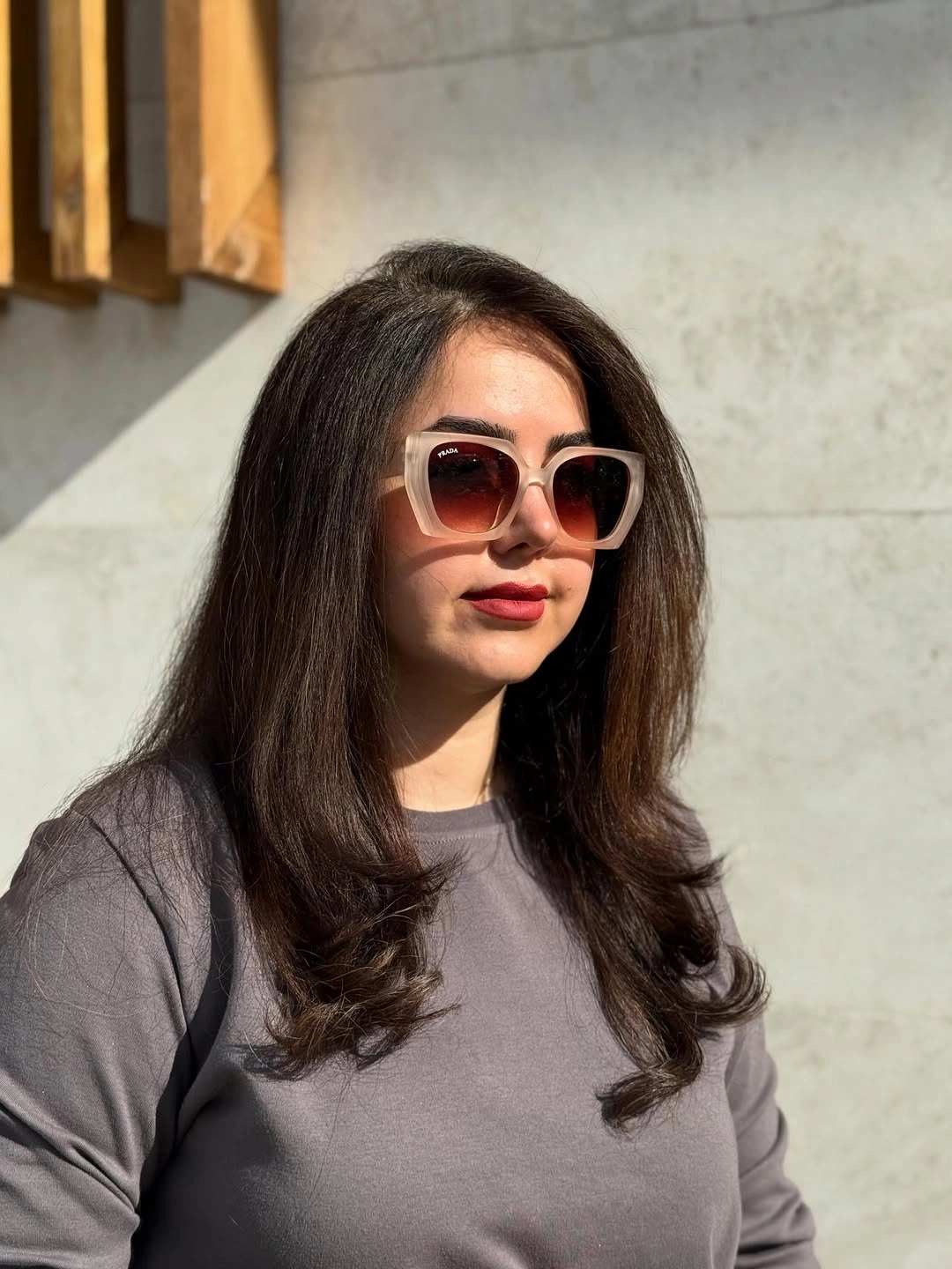 Long brunette layered haircut with curled lower ends