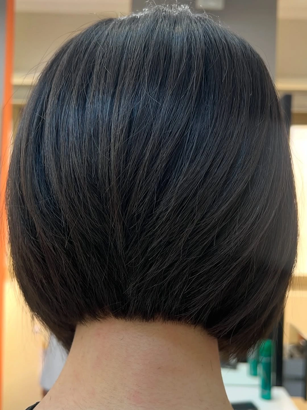 Short dark rounded bob with close curved nape