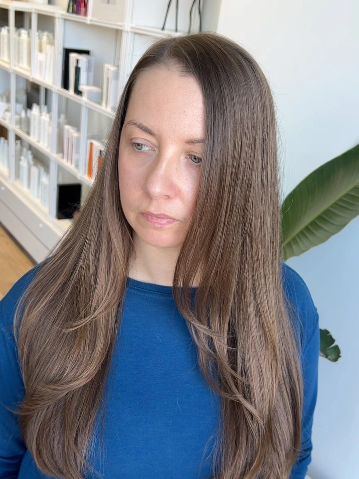 Long straight light brown hair with soft face layers