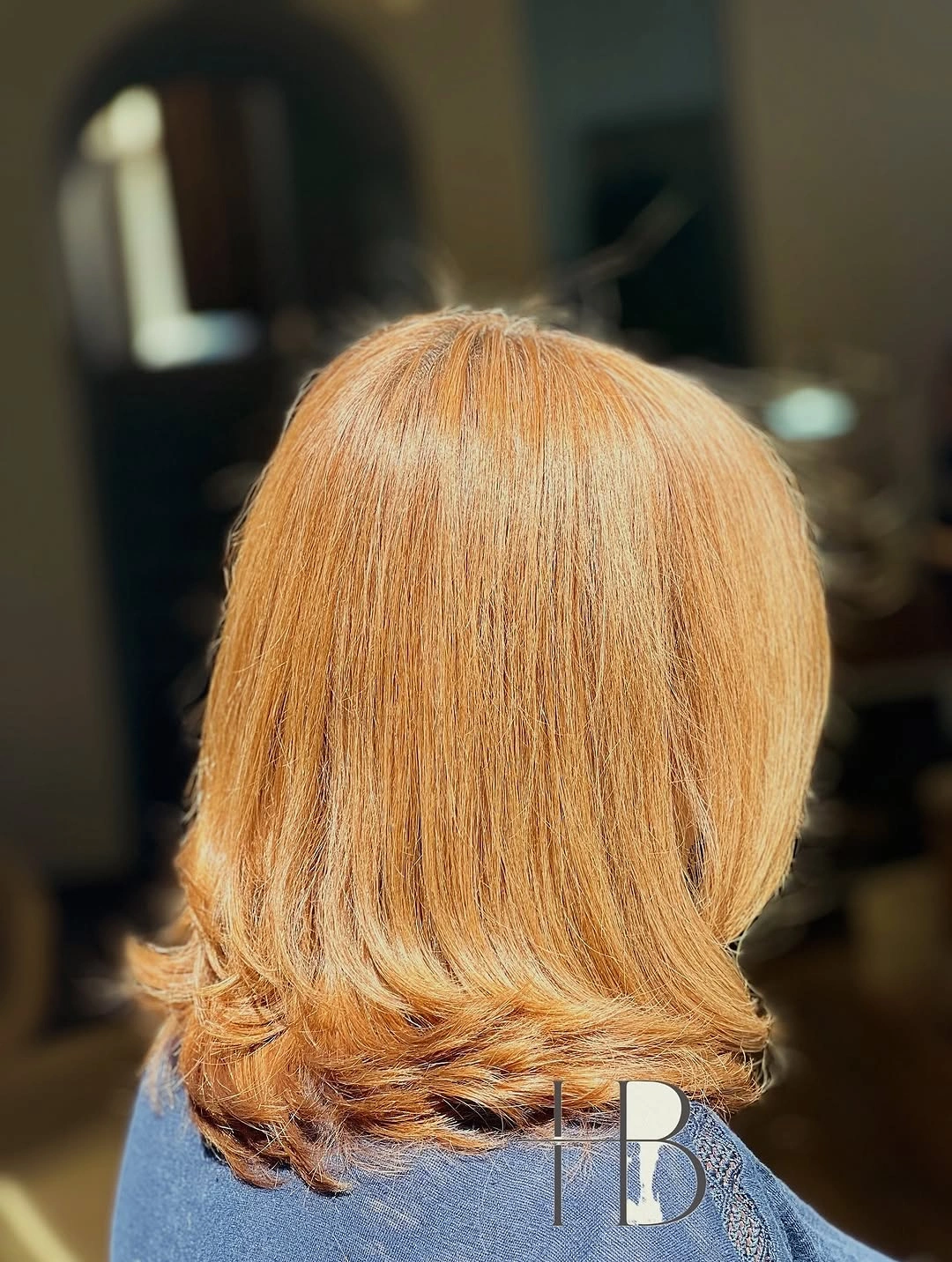 Golden copper medium haircut with rounded turned ends