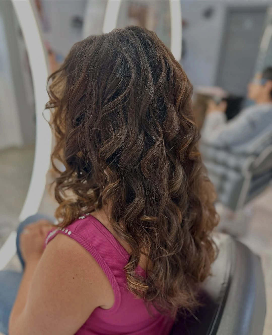 Long brown wavy layered hair with lighter ribbons