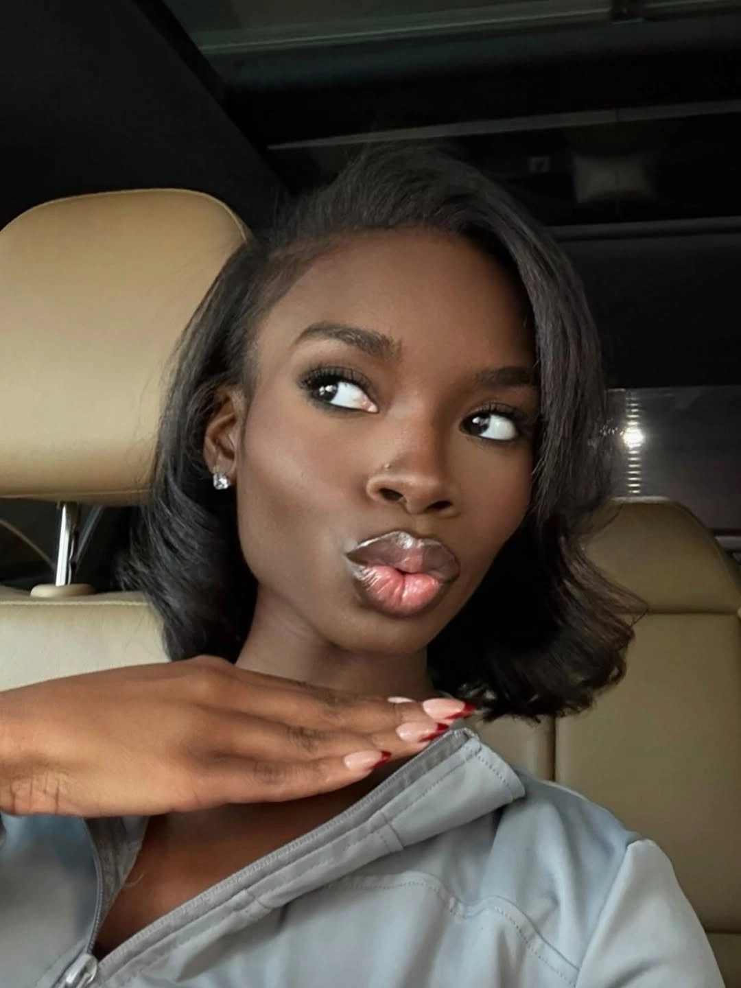 Short black bob length with side part and curved ends