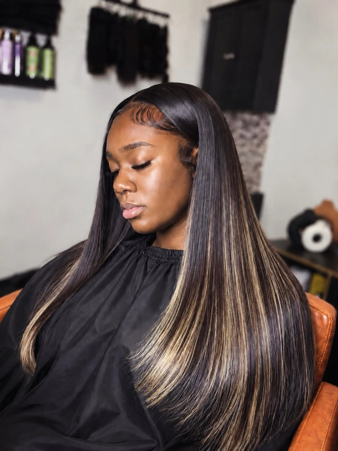 Very long straight dark hair with blonde streaks