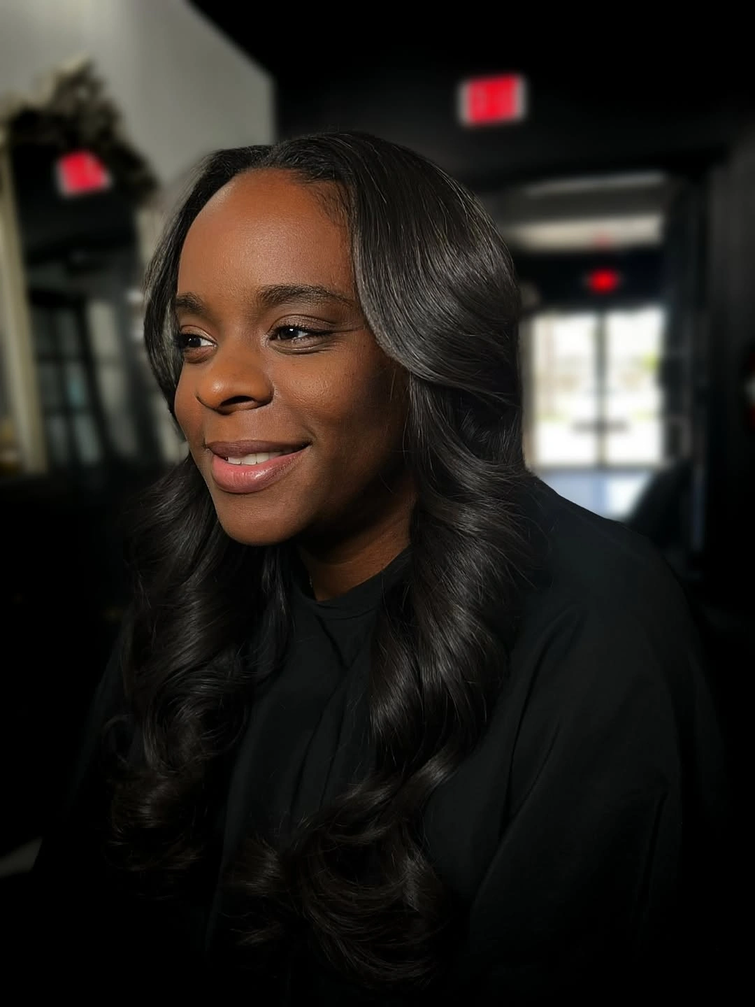 Long black wavy hair with soft center part