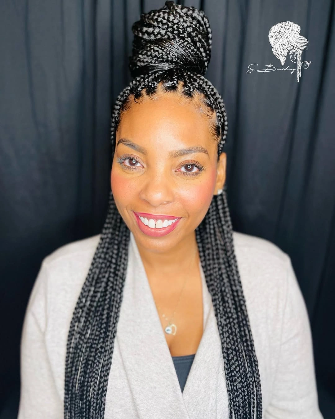 High braided top knot with long hanging braids
