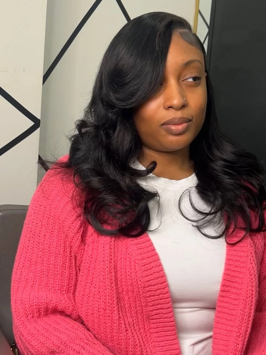 Glossy black side swept waves with rounded lower curls