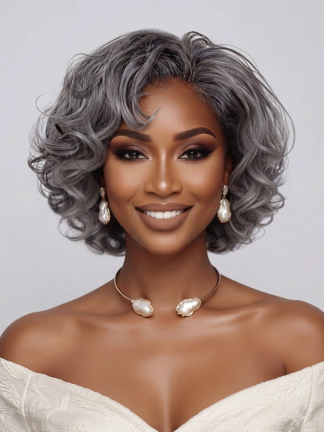 Short silver curled bob with side swept volume