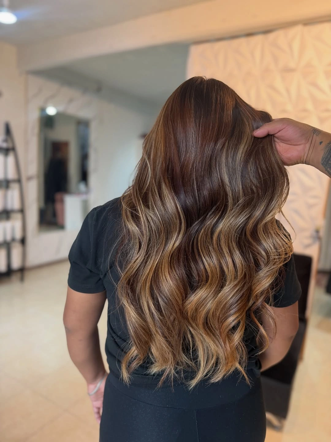 Long chestnut brown waves with caramel-toned lower pieces