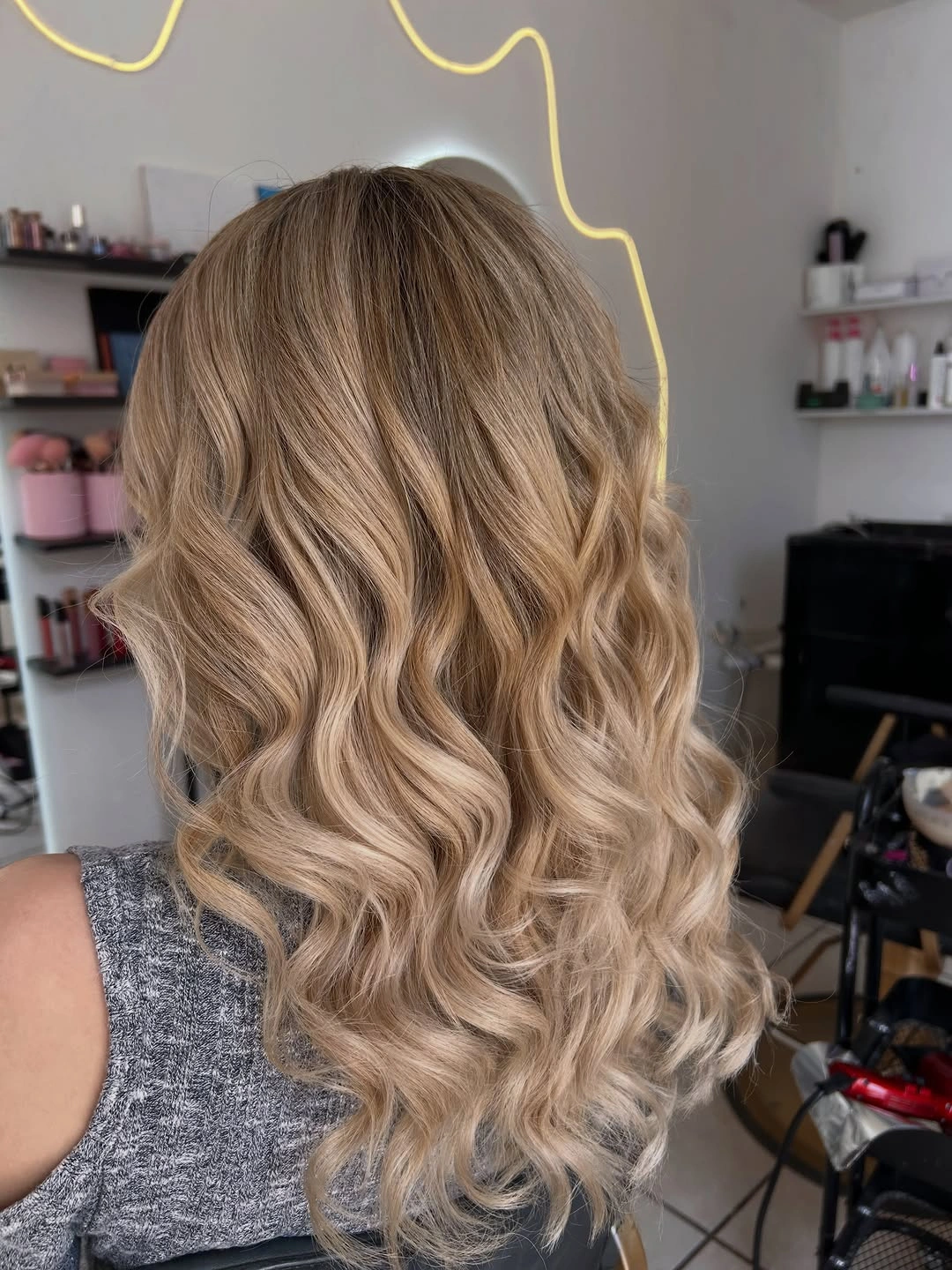 Long warm beige blonde waves viewed from behind