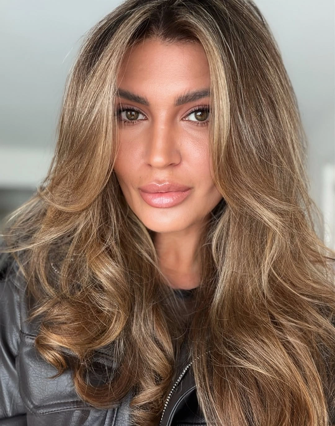 Long beige dark blonde hair with voluminous front layers