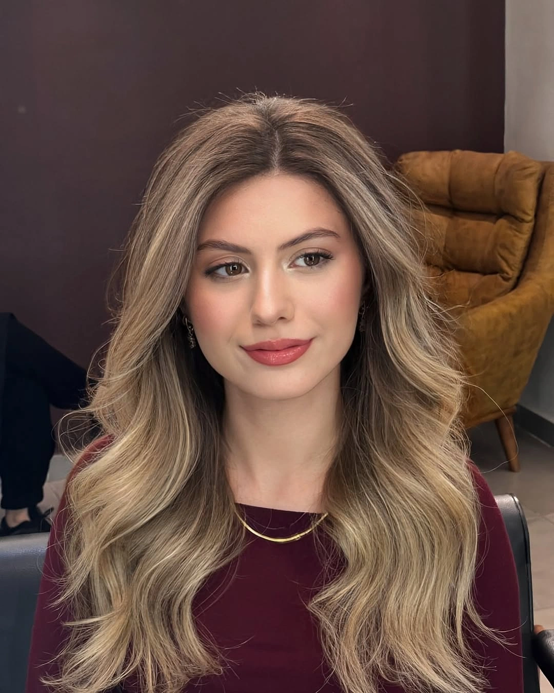 Long beige blonde waves with center part and side layers