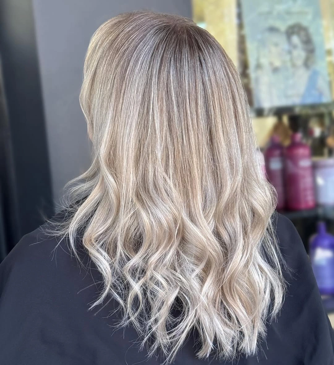 Shoulder length platinum blonde waves with fairly blunt ends