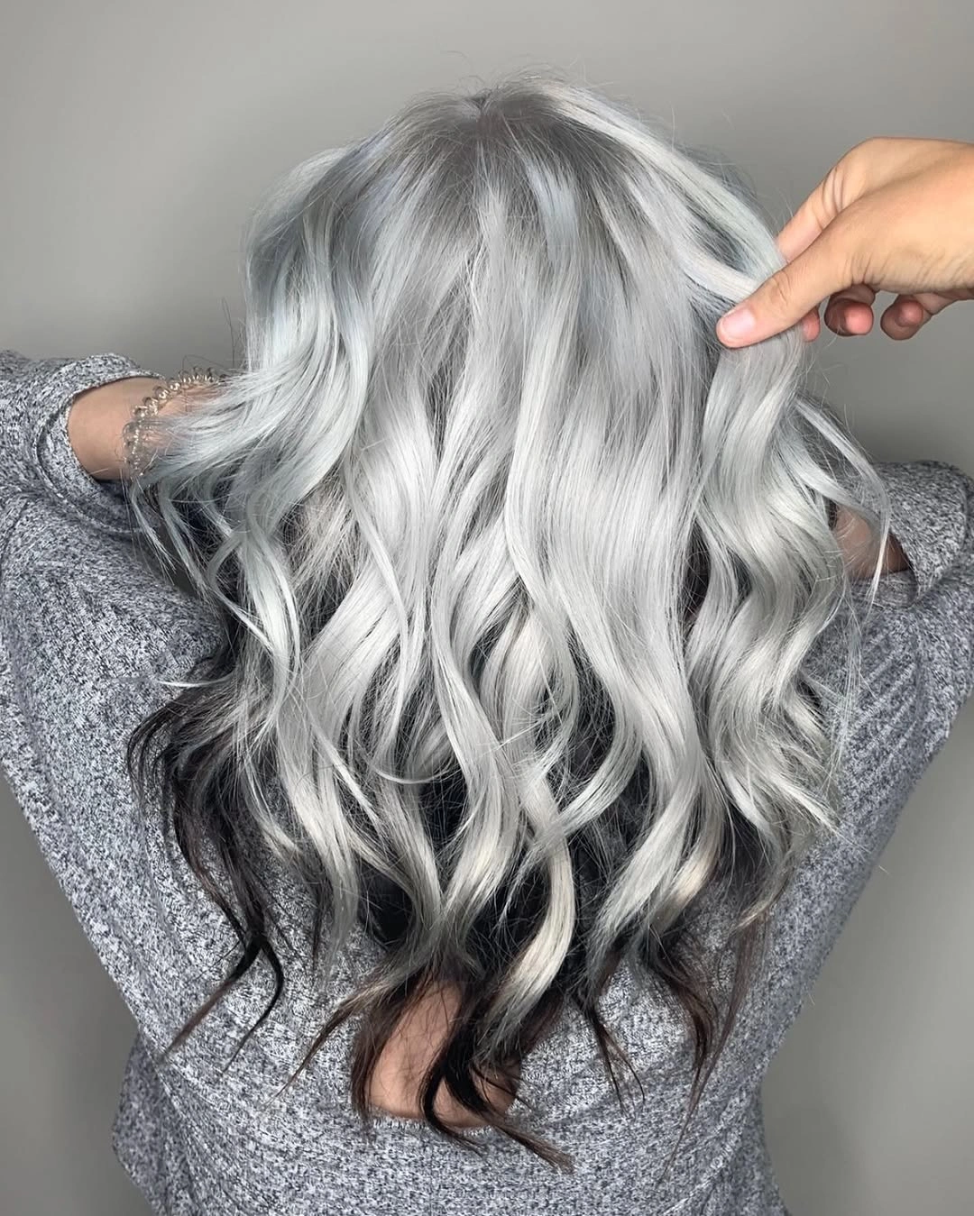 Long silver white waves from back with darker lower sections