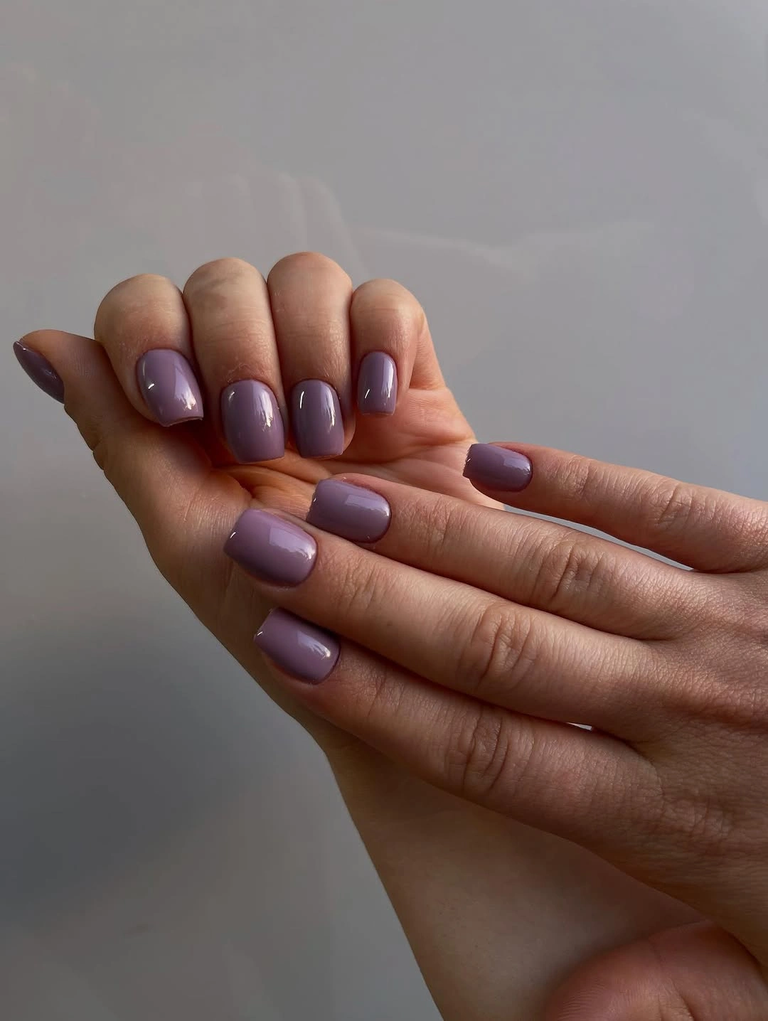 Short square mauve nails with glossy lavender-gray color