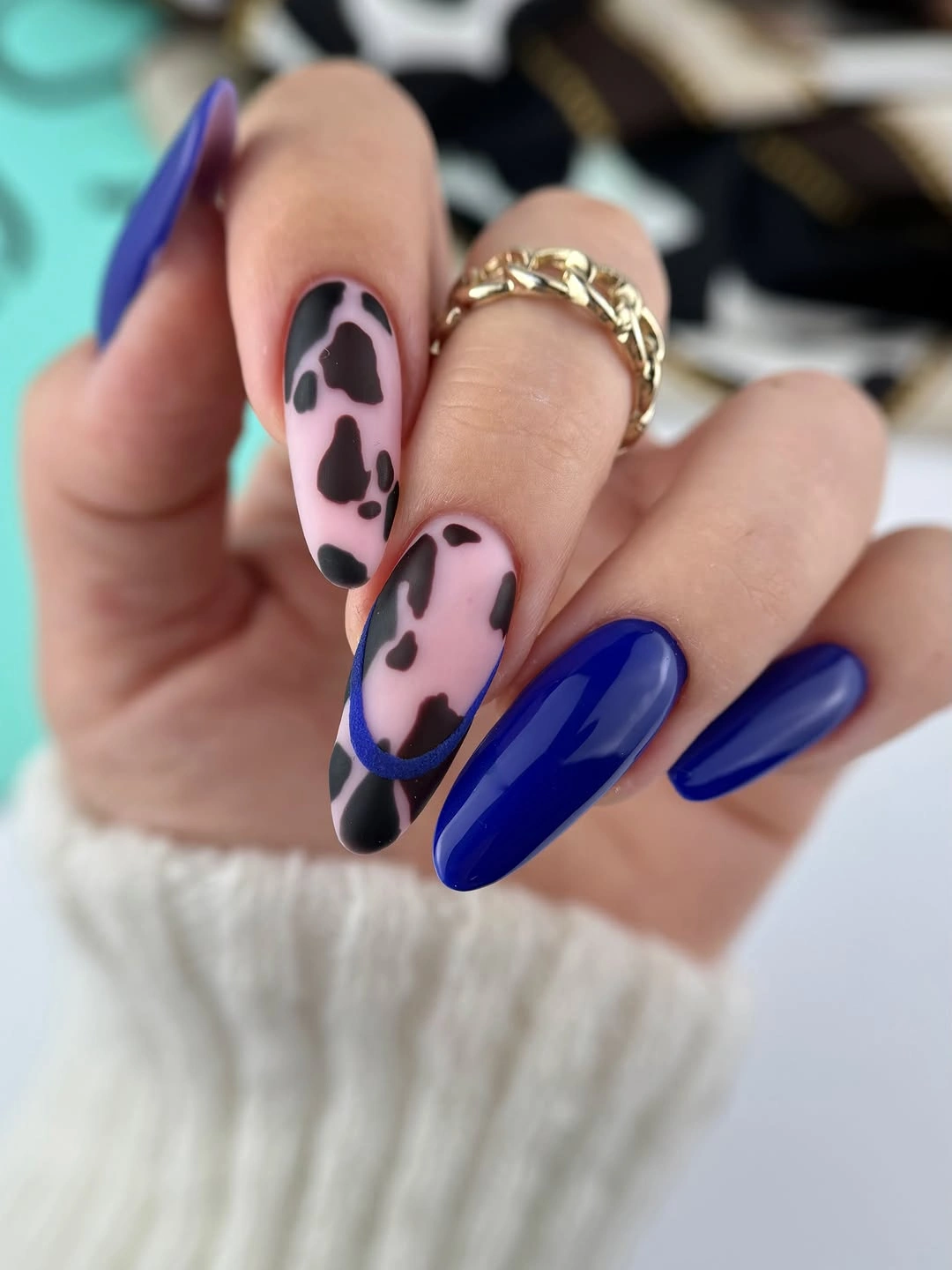 Long almond nails, cobalt blue, nude-pink cow print, blue lines