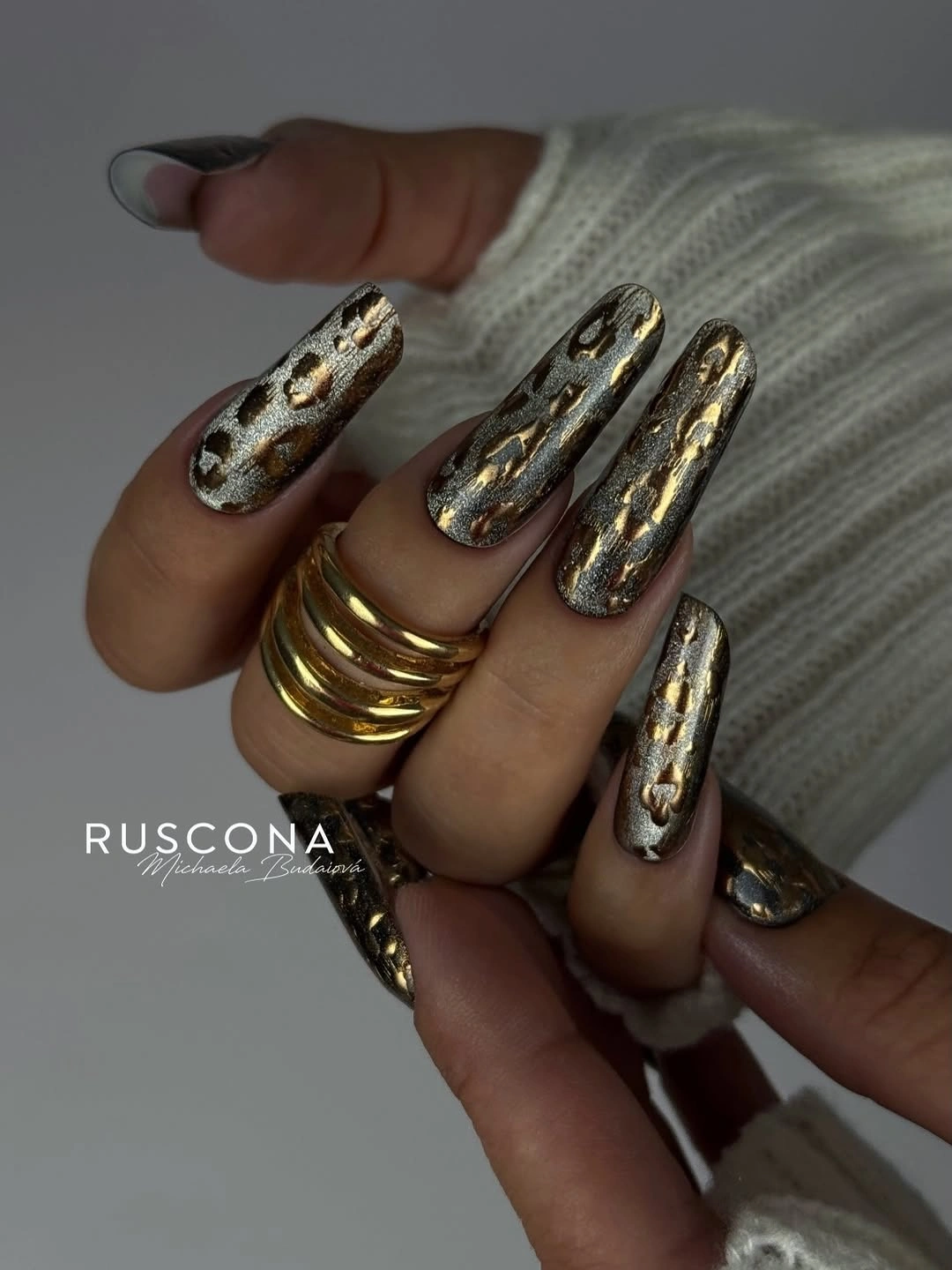 Long nails with gold silver black and smoky spotted texture