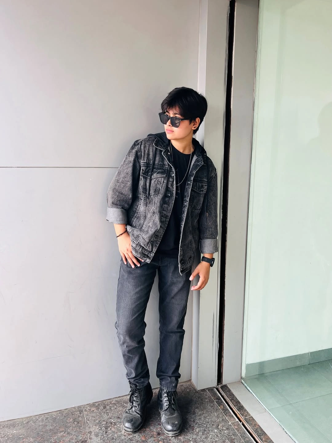 Brown textured short sleeve polo with wide dark trousers