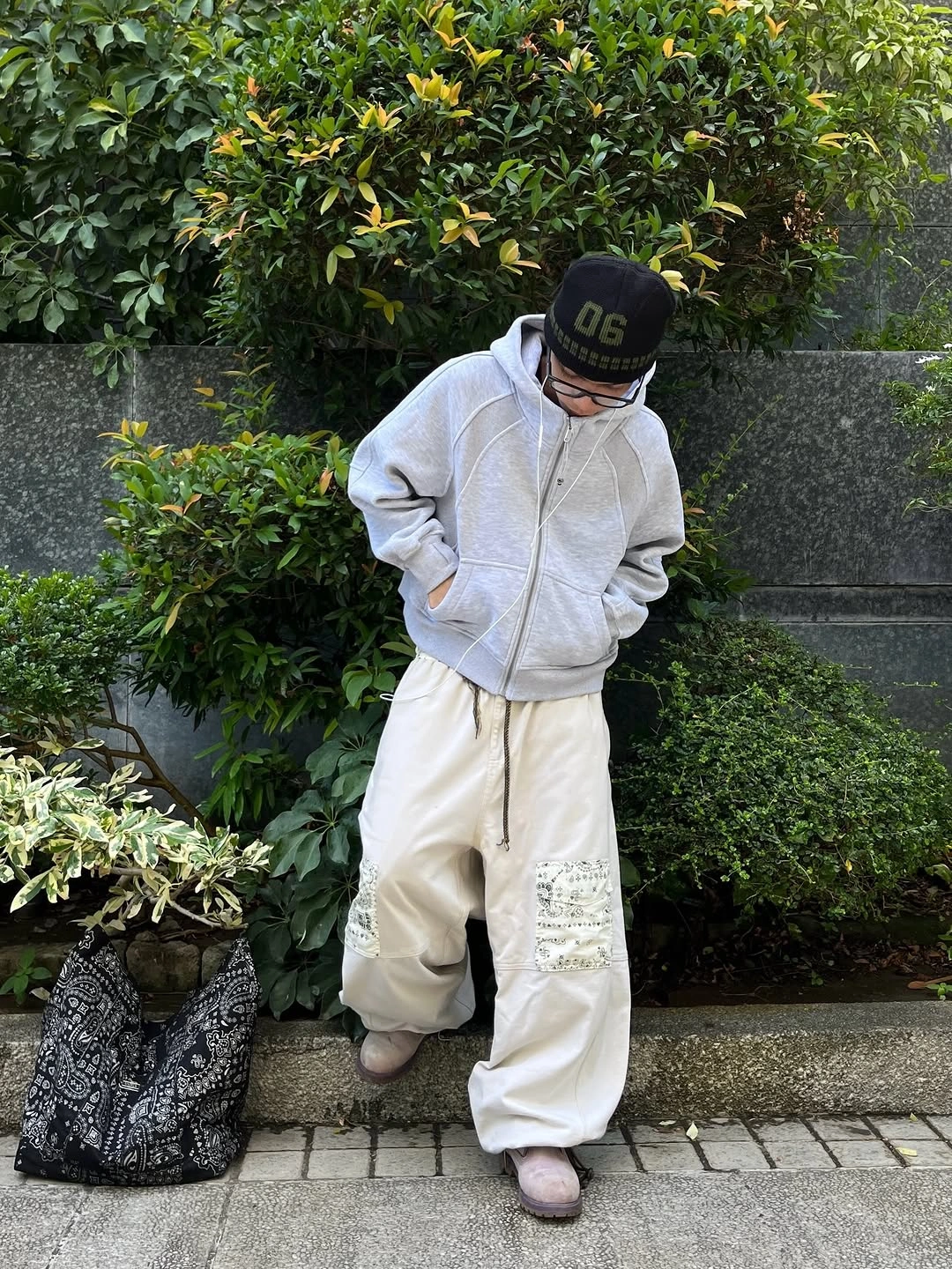 Charcoal graphic knit cream wide trousers and white sneakers